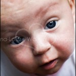 Close up of baby looking at the camera - Baby Newborn and First Year Photography at portrait photography studio in Burnham