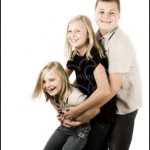 Family Portrait Photography - Three kids hugging smiling and laughing