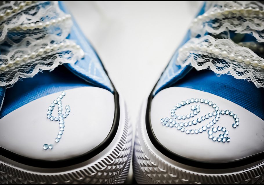 Blue wedding shoes with rhinestone "I Do" photographed in detail by wedding photographer in Burnham, Slough